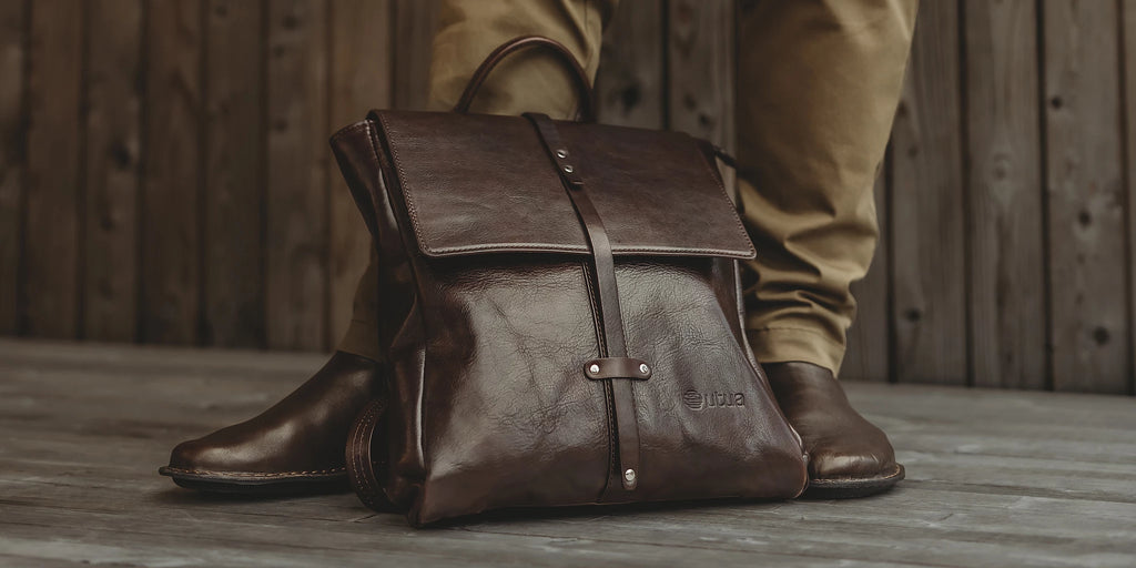 Dark brown leather backpack.